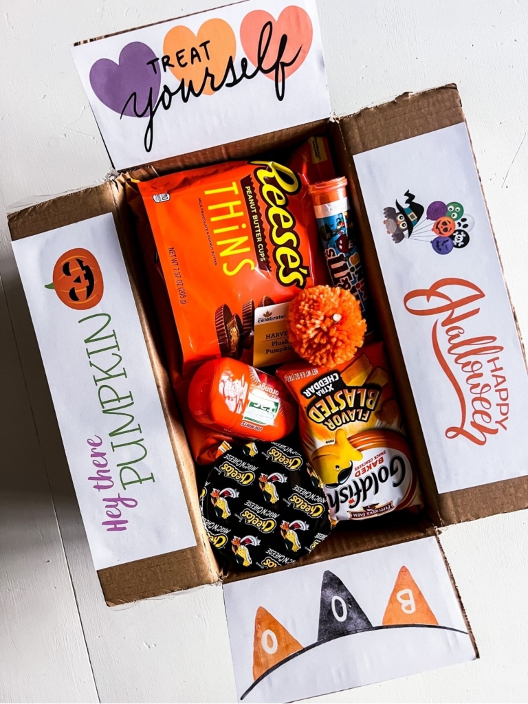 Halloween college care package with orange theme. Box decorated with care package Halloween printables.